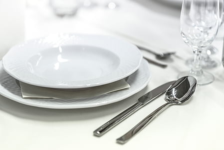 photo of stainless steel knife beside white ceramic plate thumbnail