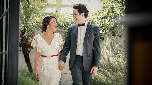 coupe standing while holding hands during daytime thumbnail