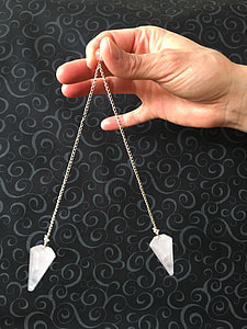 person holding silver jewelry thumbnail