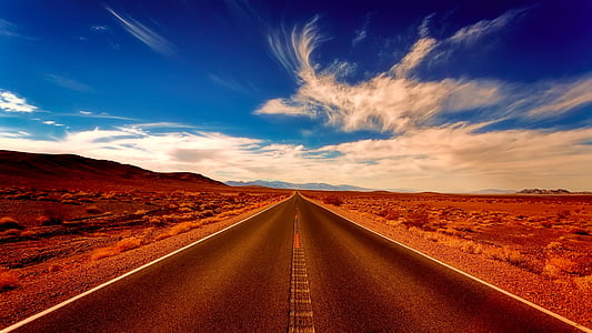 narrow road near rocky mountain thumbnail