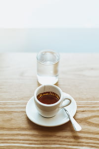 white ceramic cup filled with coffee thumbnail