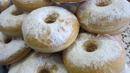 doughnut with white powder close-up photo thumbnail