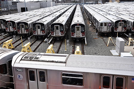 parked gray-and-black train lot at day time thumbnail