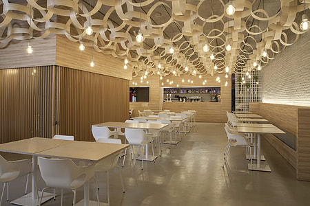 white wooden table set inside building thumbnail