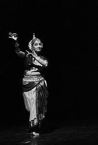 grayscale photography of a woman dancing in dark room thumbnail