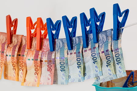 banknotes hanging on clothes line thumbnail