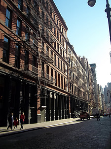 people walking near building at daytime thumbnail