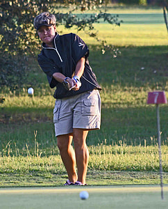 woman playing golf during daytime thumbnail