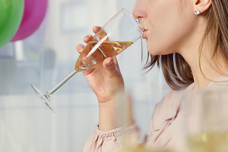 Girl drinking a glass of champagne thumbnail