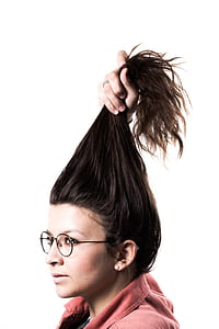 woman wearing black framed eyeglasses while his hair holding thumbnail