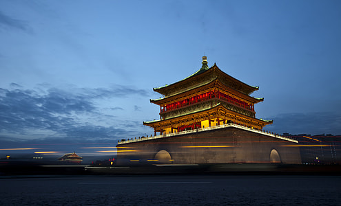 red and black temple under blue sky during night time thumbnail