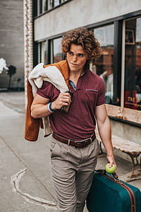 man carrying luggage bag thumbnail