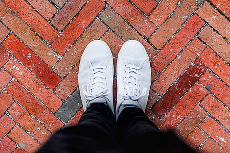 closeup photo of person wearing low-top sneakers thumbnail