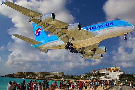 Korean airplane hanging on white cloudy sky thumbnail