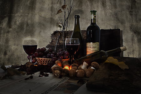 three wine bottles and two glasses surrounded by fruits thumbnail