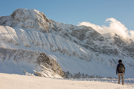 man walking on snowy field thumbnail