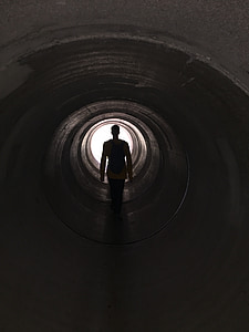 man passing through tunnel thumbnail
