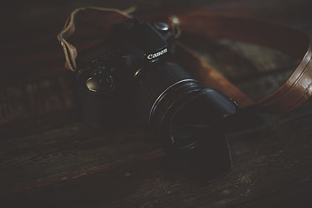 black Canon DSLR camera thumbnail