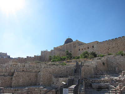 low-angle photography of white and brown concrete building under blue sky thumbnail