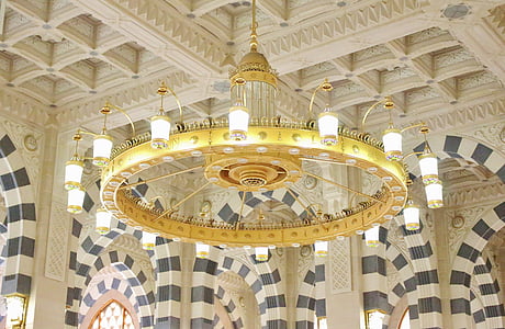 vintage brass-colored chandelier turned-on thumbnail