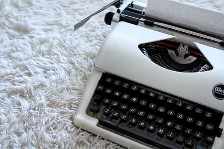 closeup photo of white and black typewriter thumbnail
