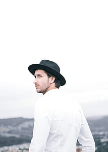 Man Wearing White Shirt And Black Hat thumbnail