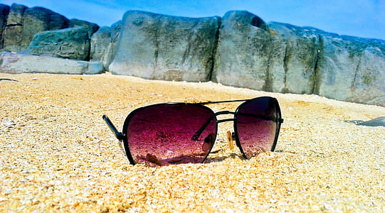 photo of sunglasses on seashore thumbnail