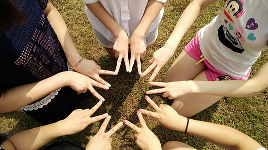 group of girl forming star using fingers thumbnail