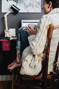 Woman drinking hot tea in her home office thumbnail