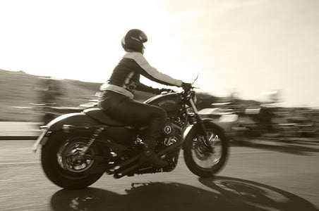 person riding motorcycle time lapse photo thumbnail