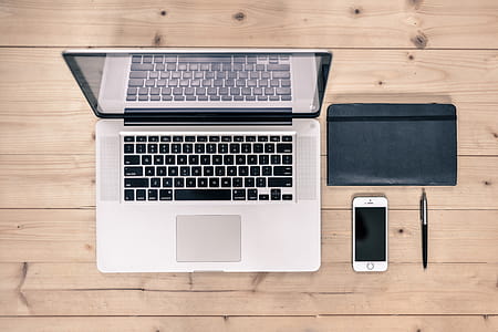 Macbook Pro Beside Silver Iphone 5s thumbnail