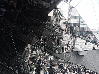 grayscale photography of people reflected on glass thumbnail
