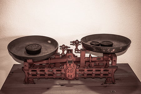 brown and black beam balance scale thumbnail