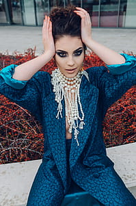 Woman Wearing Blue Long-sleeved Dress thumbnail