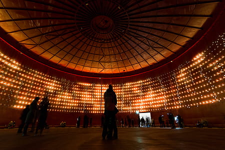 silhouette of people inside dome building thumbnail