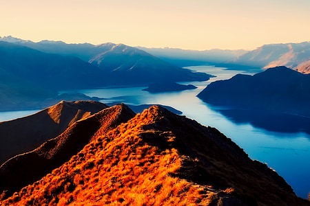mountain surrounded by water thumbnail