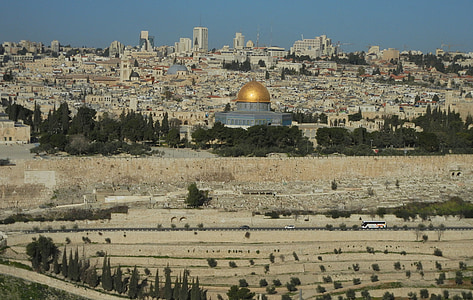 aerial view of brown and gray dome building during daytime thumbnail