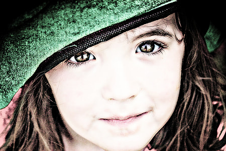 photo of child smiling wearing green hat thumbnail
