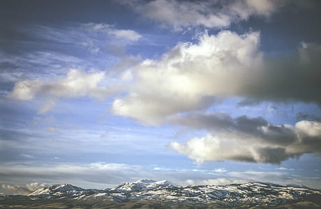 Clouds and snow capped peaks thumbnail
