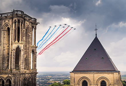 highrise cathedral under jet plane airshow thumbnail
