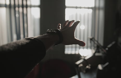 person wearing black and silver watch thumbnail