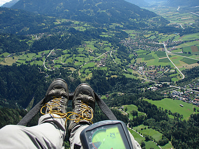 person taking photo of mountain above thumbnail