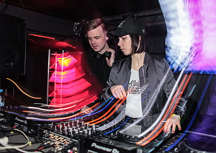 man and woman playing audio mixer thumbnail