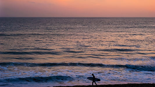 Person Walking on Seashore thumbnail
