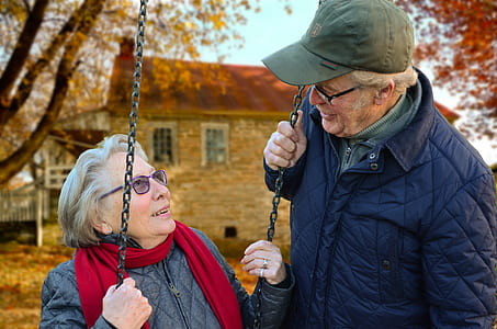 woman on swing near man thumbnail