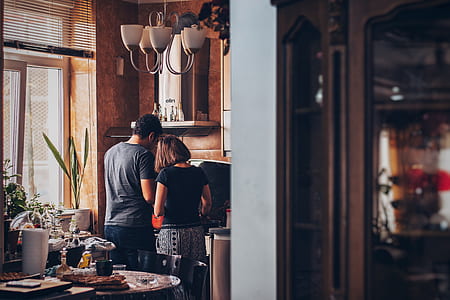 man and woman cooking at the kitchen thumbnail