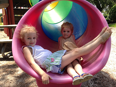 two girls inside tunnel slide thumbnail