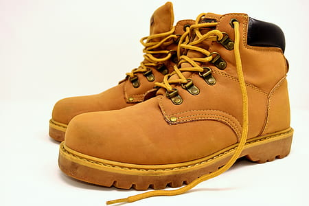 closeup photography of pair of brown leather work boots thumbnail