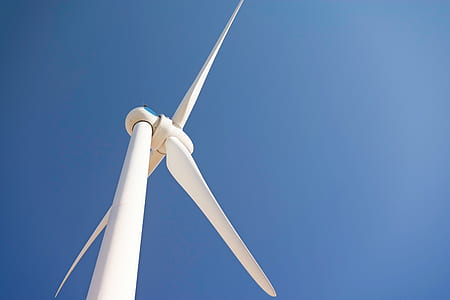 white wind turbine under clear sky thumbnail