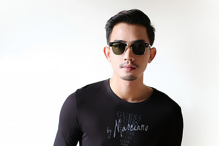 man wearing black Guess scoop-neck shirt thumbnail